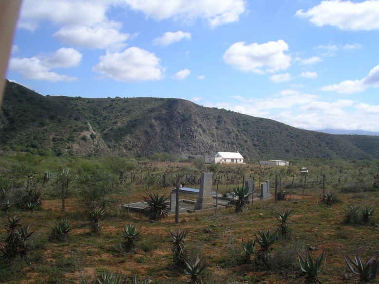 5. The cemetery with the farmhouse at the background